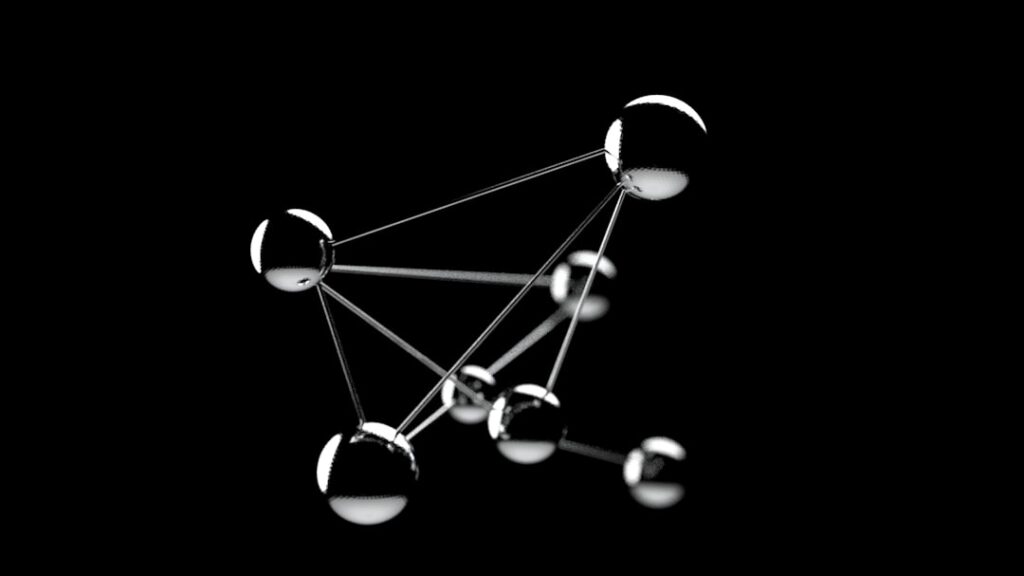 A 3D rendering of six shiny metallic spheres connected by thin rods, forming a geometric structure against a black background.